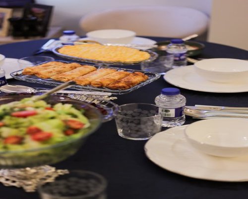 A calm family dinner table with traditional Tunisian elements